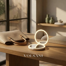 SOLEIL lighted compact mirror open on a desk beside a handbag