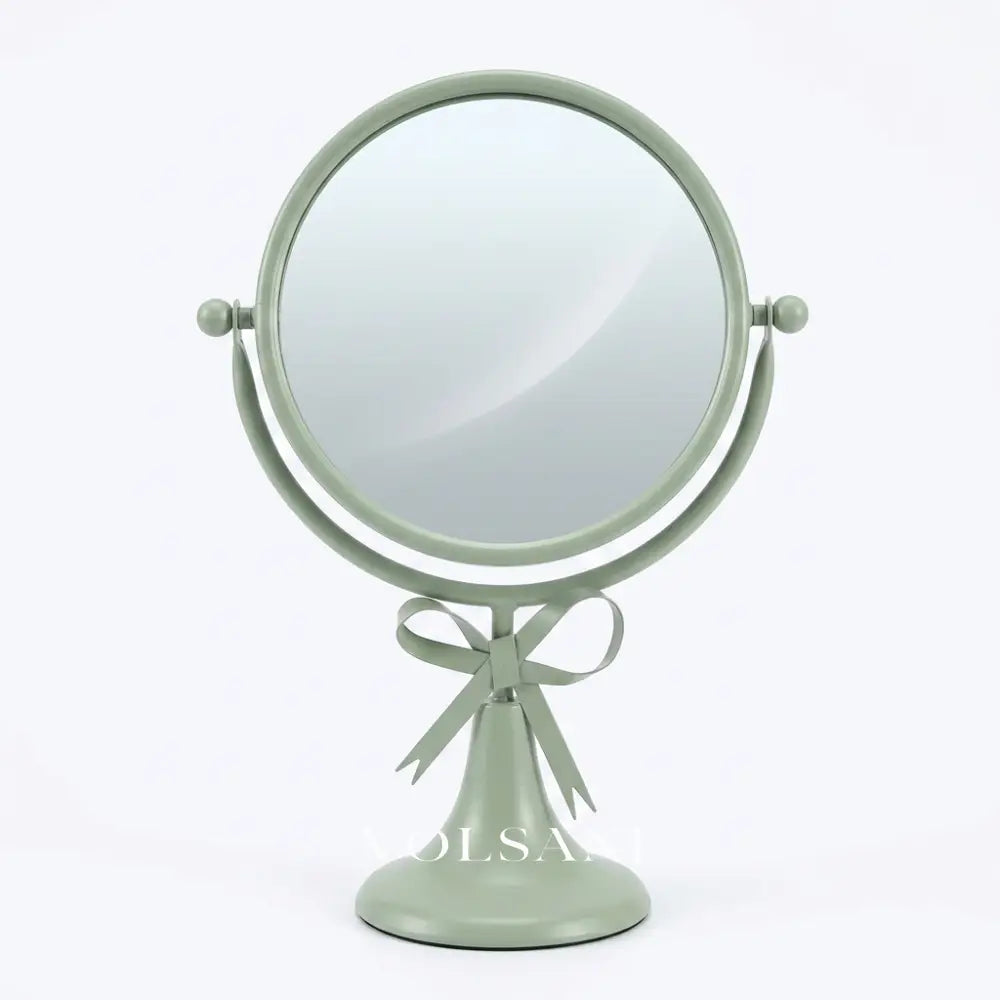 NOVA bow vanity mirror in light green on white background