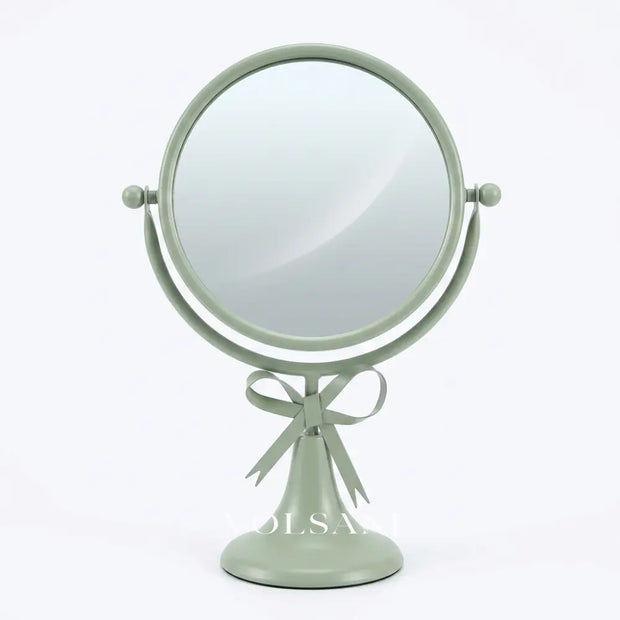 NOVA bow vanity mirror in light green on white background