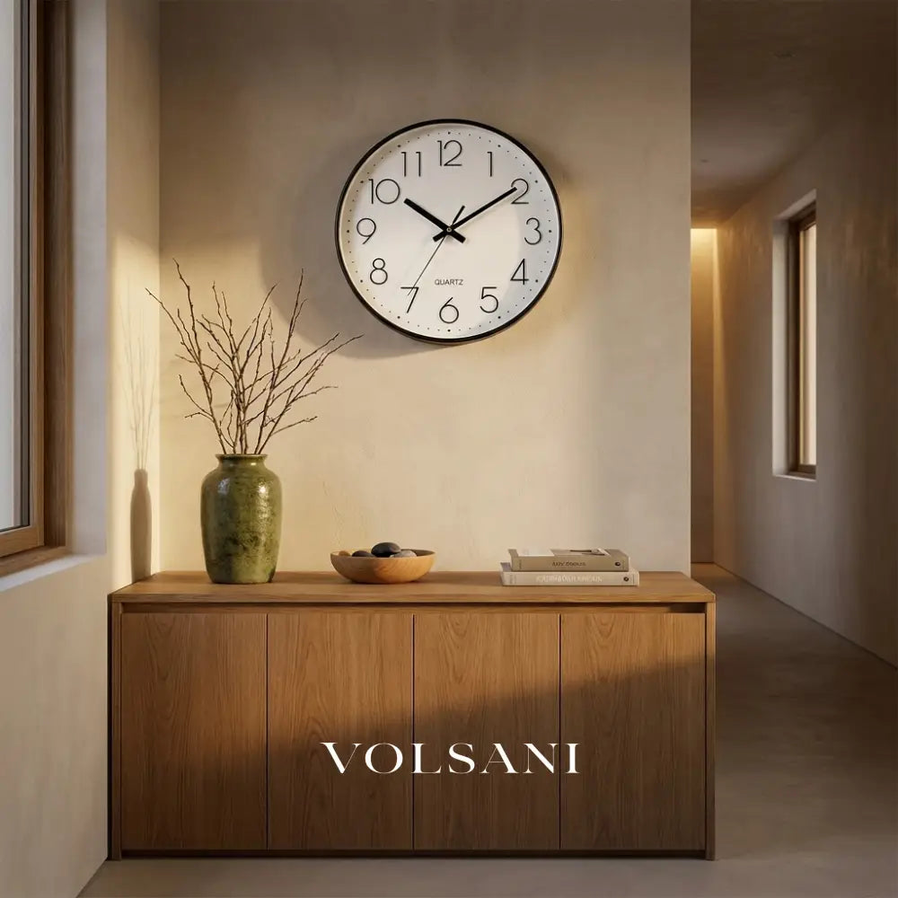 Minimalist wall clock with clean dial above a console table in a hallway