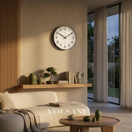 Minimalist wall clock with glass face in a living room