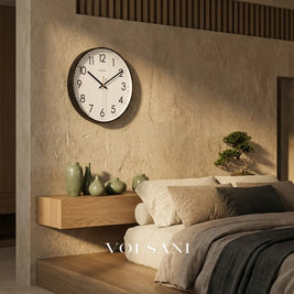 Minimalist wall clock with glass face in a bedroom