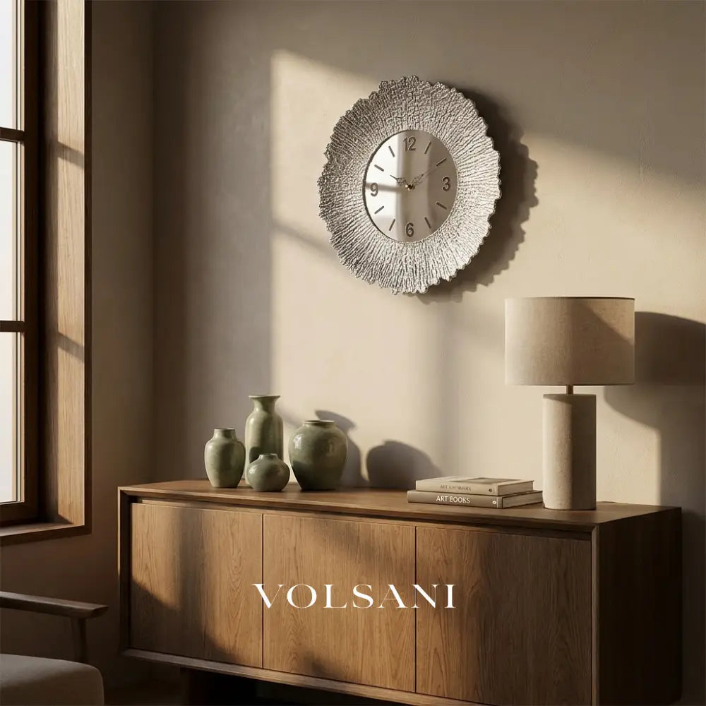 ARIA silent wall clock in silver above a console table in a living room