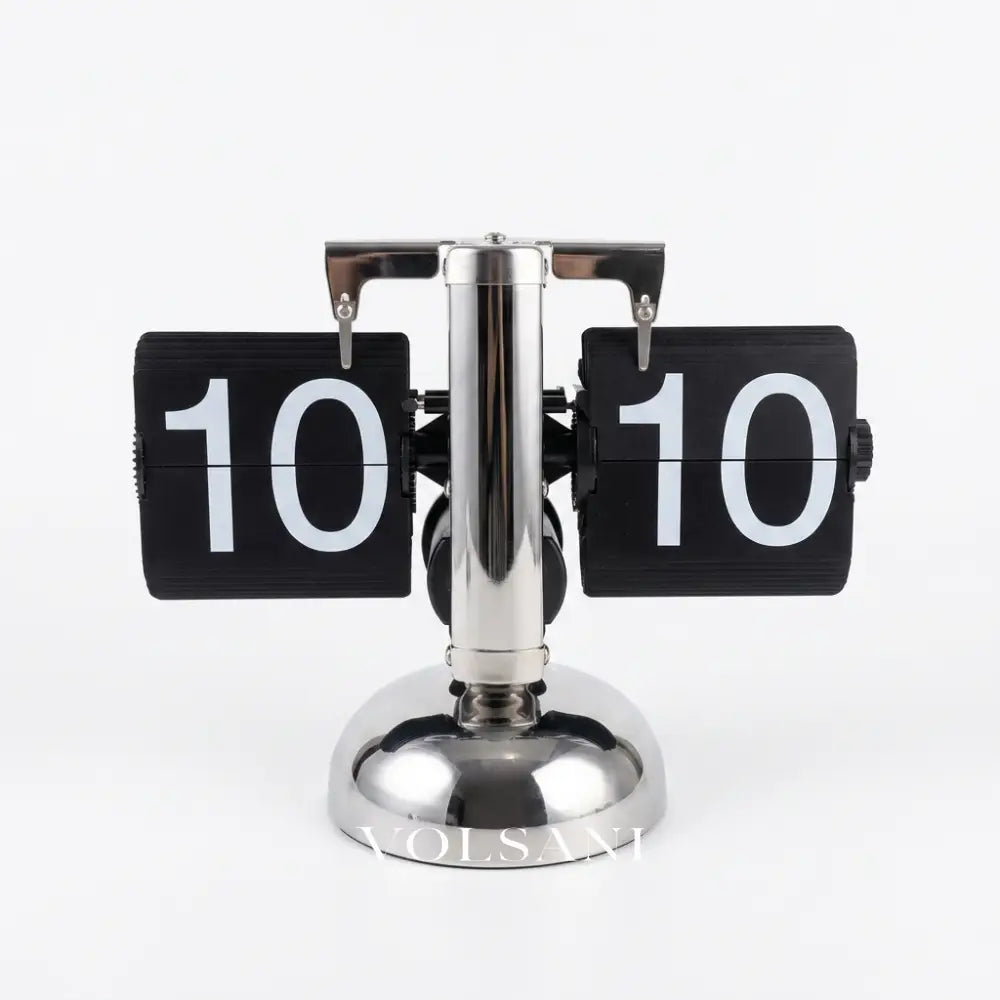 DINO vintage flip clock in silver and black 24 hour on white background