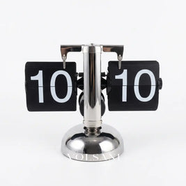 DINO vintage flip clock in silver and black 24 hour on white background