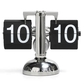 DINO vintage flip clock in silver and black on white background