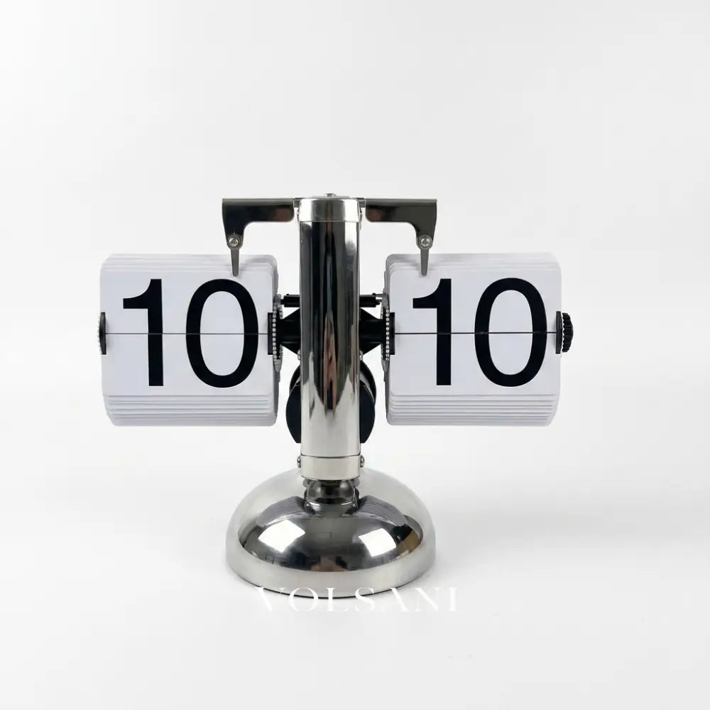 DINO vintage flip clock in silver and white 24 hour on white background