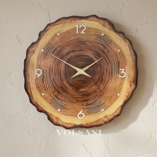 SILJE wood tree ring wall clock on a plaster wall